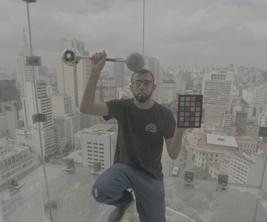 Eliel on set holding a chrome ball and a ColorChecker